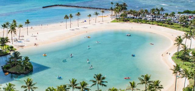 Outdoor pool next to ocean.